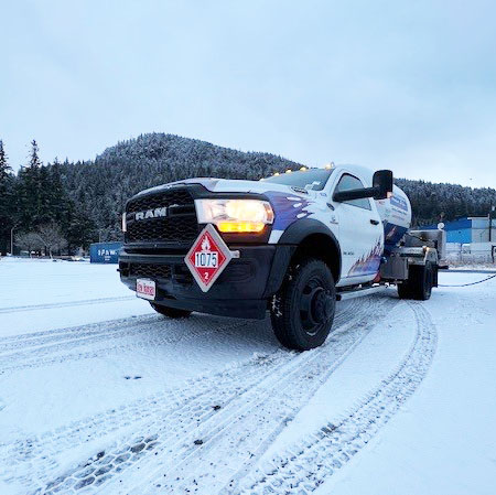 Arrowhead LP Gas driver delivering propane in winter